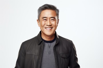 Portrait of a smiling middle-aged asian man in leather jacket