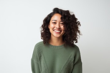 Fototapeta premium Portrait of a smiling young woman with curly hair over white background