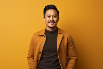 Obraz premium Portrait photography of a satisfied Chinese man in his 30s wearing a cozy sweater against an abstract background 