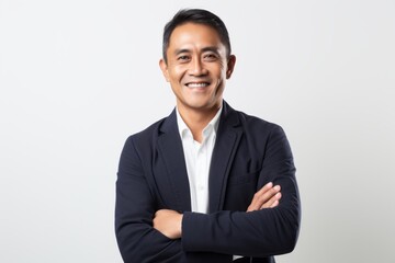 Portrait of a smiling young asian business man on white background