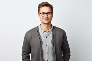 Portrait of handsome young man in eyeglasses looking at camera