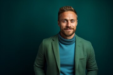 Fototapeta premium Portrait photography of a pleased Russian man in his 30s wearing a chic cardigan against an abstract background 