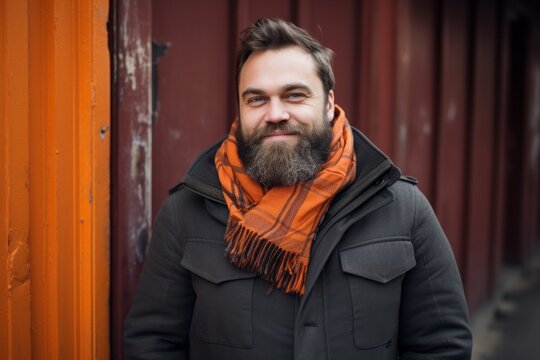 Portrait photography of a pleased Russian man in his 30s wearing a charming scarf against an abstract background 