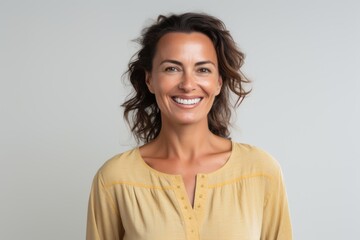 Fototapeta premium Portrait of a beautiful woman smiling at the camera isolated on a white background