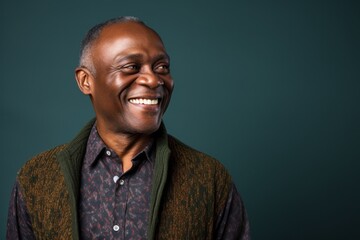 Fototapeta premium Portrait of happy african american senior man smiling at camera