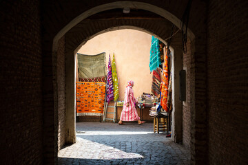 Arabic Woman walking through the souk in Marrakesh 
