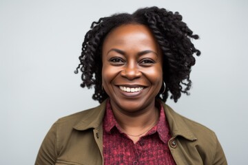 Portrait of a smiling african american woman on grey background