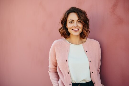 Portrait photography of a cheerful Russian woman in her 30s wearing a chic cardigan against a pastel or soft colors background 