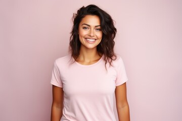 Portrait of a smiling beautiful young woman in pink t-shirt