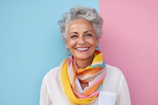 Portrait photography of a pleased Brazilian woman in her 70s wearing a foulard against a pastel or soft colors background 