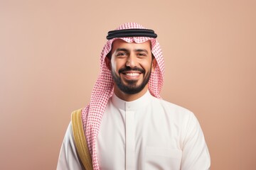 Portrait of a smiling arabian man on a pink background