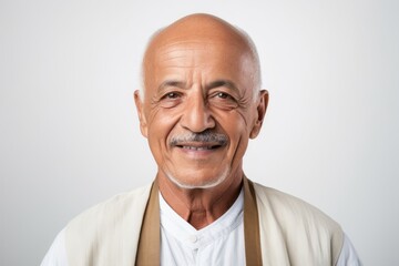Fototapeta premium Portrait of an old man with a smile on a white background