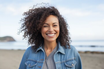 Portrait of a smiling young woman at the beach on a sunny day