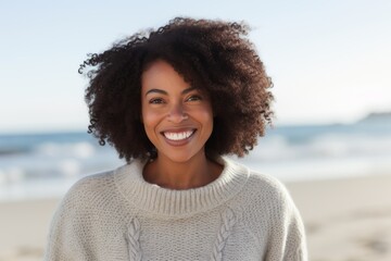 Portrait of a smiling young woman on the beach at the day time