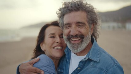 Cinematic video of a senior couple spending time on the beach and making different activities near the ocean. Romantic concept about a man and a woman in love. Lifestyle in the seniority age - Powered by Adobe