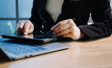 close up hands multitasking man using tablet, laptop and cellphone connecting wifi