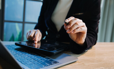 close up hands multitasking man using tablet, laptop and cellphone connecting wifi
