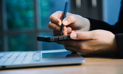 close up hands multitasking man using tablet, laptop and cellphone connecting wifi