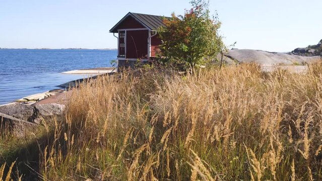 View of Hanko town coast, Hango, Finland, with beach and coastal waterfront, wooden houses and beach changing cabins, Uusimaa, Hanko Peninsula, Raseborg sub-region, summer sunny day 
