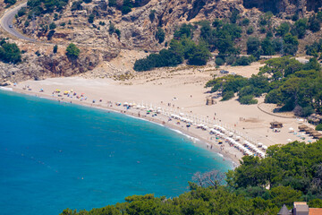 Fototapeta na wymiar Kidrak Beach Nature Park in Oludeniz district. Mugla, Turkey - July 10, 2023.
