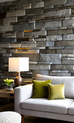 light grey colour morden living room sofa with pillows in front of a natural stone wall