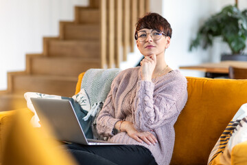 Woman with laptop at home focus and planning