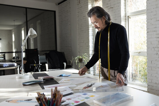 Authoritative fashion designers draw design drafts