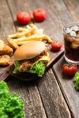 Cheeseburger, Potato, nuggets on a wooden board