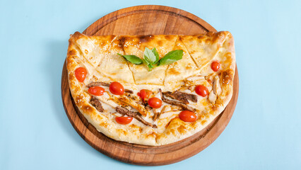 Mini sliced pizza with meat and tomatoes top view