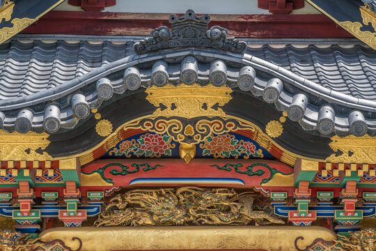 Sezonin temple colorful facade carved golden Dragon. Karahafu Style roof detail. Located in Nagano City, Japan