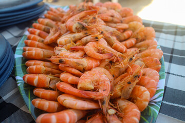 A platter of cooked fresh shrimp with garlic bits that is part of the seafood boodle fight in the Philippines
