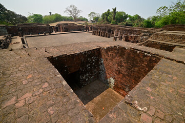 Archaeological site depicting brick walls of ancient Buddhist Monastery complex at Ratnagiri Buddhist archaeological site, Odisha, India.