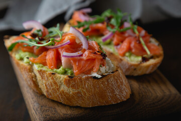 Bruschetta with cream cheese, avocado and trout