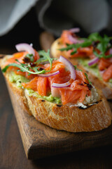 Bruschetta with cream cheese, avocado and trout