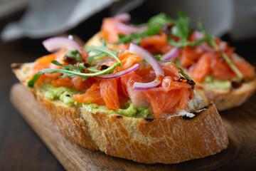 Bruschetta with cream cheese, avocado and trout