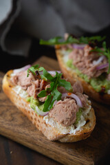 Bruschetta with tuna cream cheese and arugula