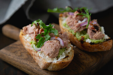 Bruschetta with tuna cream cheese and arugula