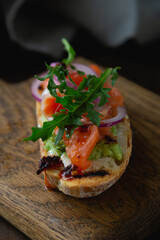 Bruschetta with cream cheese, avocado and trout