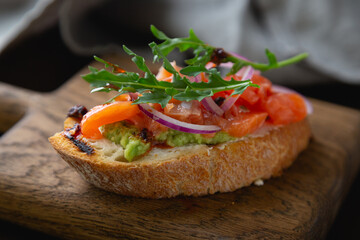 Bruschetta with cream cheese, avocado and trout