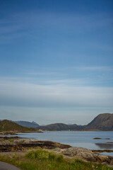 Fototapeta na wymiar vertical view of sea bay lake surrounded by mountains sunny day
