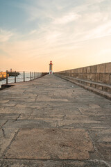 Farolim de Felgueiras, Pier and lighthouse at Porto, Portugal During sunset.