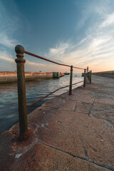 Farolim de Felgueiras, Pier and lighthouse at Porto, Portugal During sunset.
