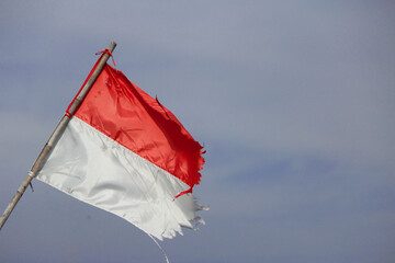 The worn and torn indonesian flag