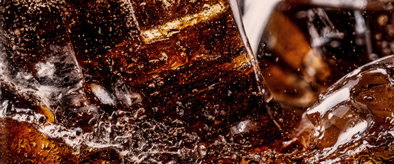 Pouring of Cola and Ice. Cola soda and ice splashing fizzing or floating up to top of surface. Close up of ice in cola water. Texture of carbonate drink with bubbles in glass. Cold drink background - obrazy, fototapety, plakaty