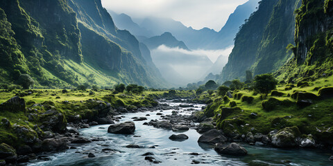 A misty Colombian mountain range with jagged peaks covered in thick clouds. The landscape is rugged and awe-inspiring, with deep valleys and cascading rivers.