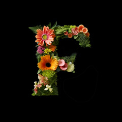 Letter F made of flowers and plants on black background. Flower font concept