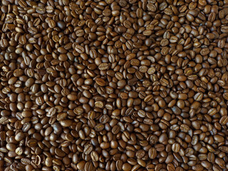 Roasted coffee beans stacked abstract background  Aromatic bitter coffee that is popular to eat in the morning to feel refreshed. cure drowsiness.