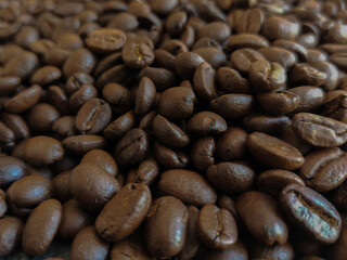 Roasted coffee beans stacked abstract background  Aromatic bitter coffee that is popular to eat in the morning to feel refreshed. cure drowsiness.