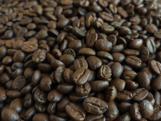 Roasted coffee beans stacked abstract background  Aromatic bitter coffee that is popular to eat in the morning to feel refreshed. cure drowsiness.