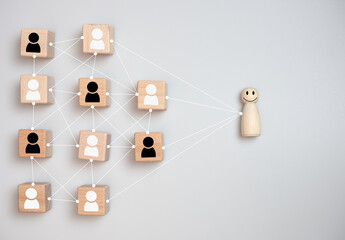 concept Business and HR for leadership and team leader, one wooden dolls stand out in front ...